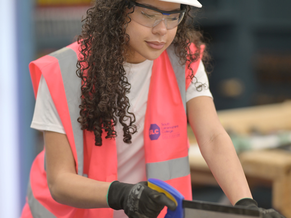 Joinery student in workshop wearing SLC PPE