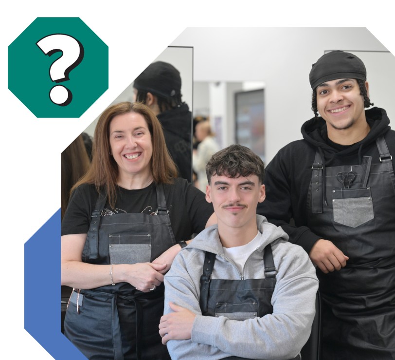 Group of Barbering students smiling in South Lanarkshire College barber shop 